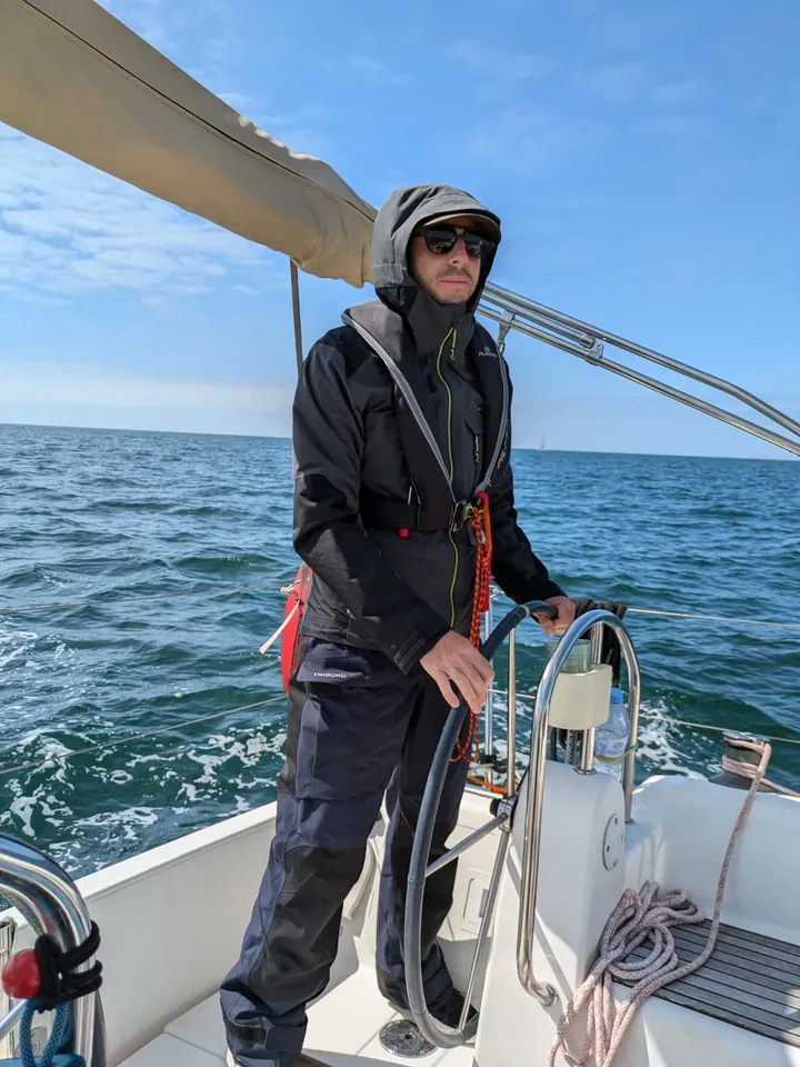Matthieu Laborie at the helm of his sailing boat, off La Rochelle